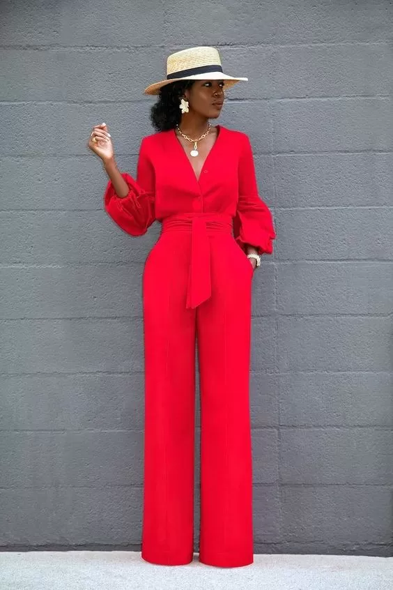 Vibrant red jumpsuit with wide legs and belted waist