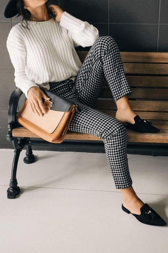 Monochrome knit sweater with checkered pants