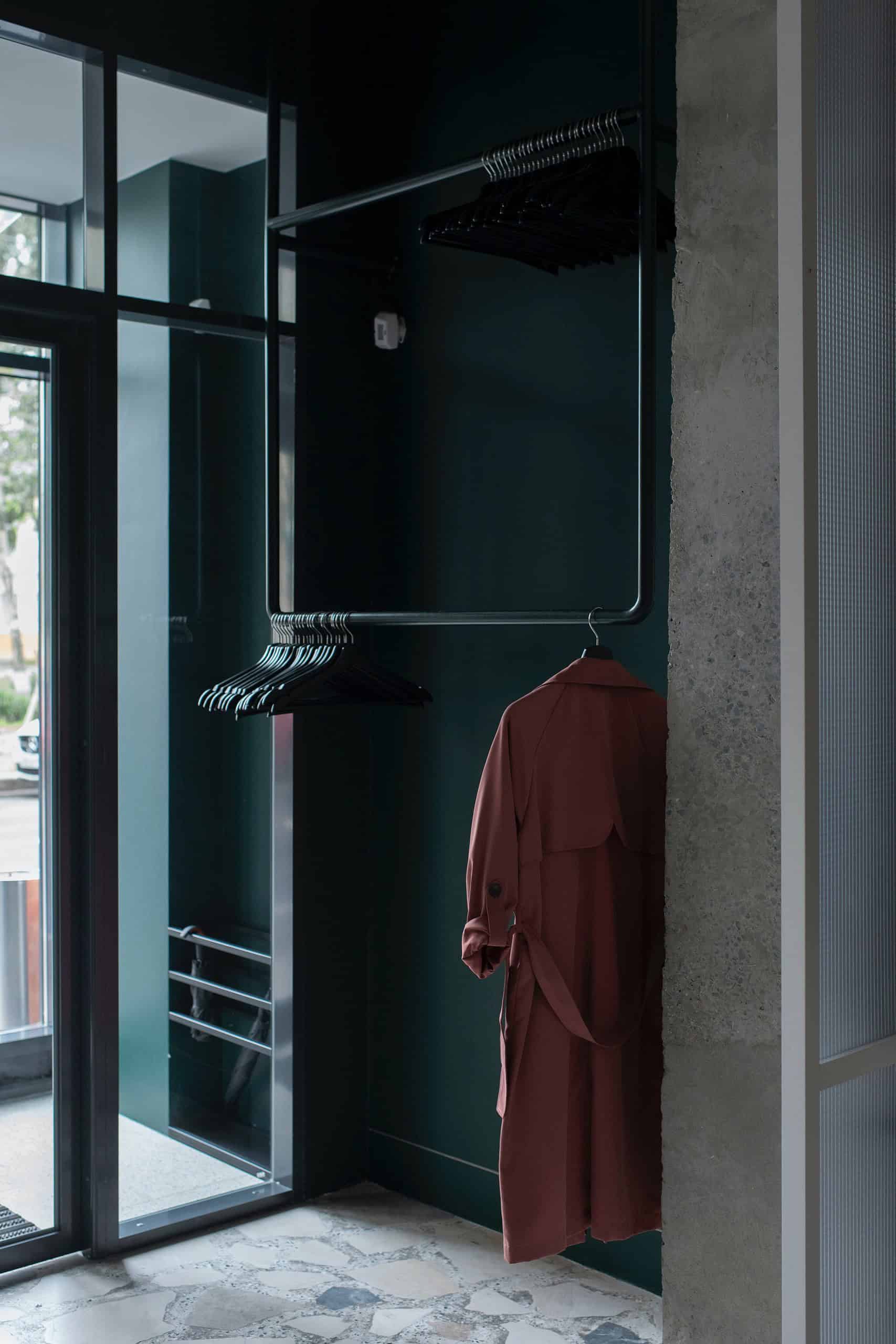 Muted trench coat hanging in store