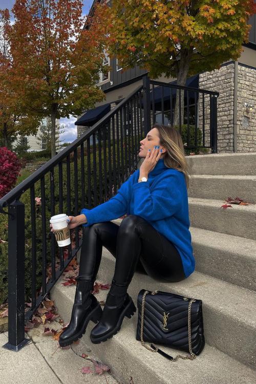 Blue sweater with leather leggings