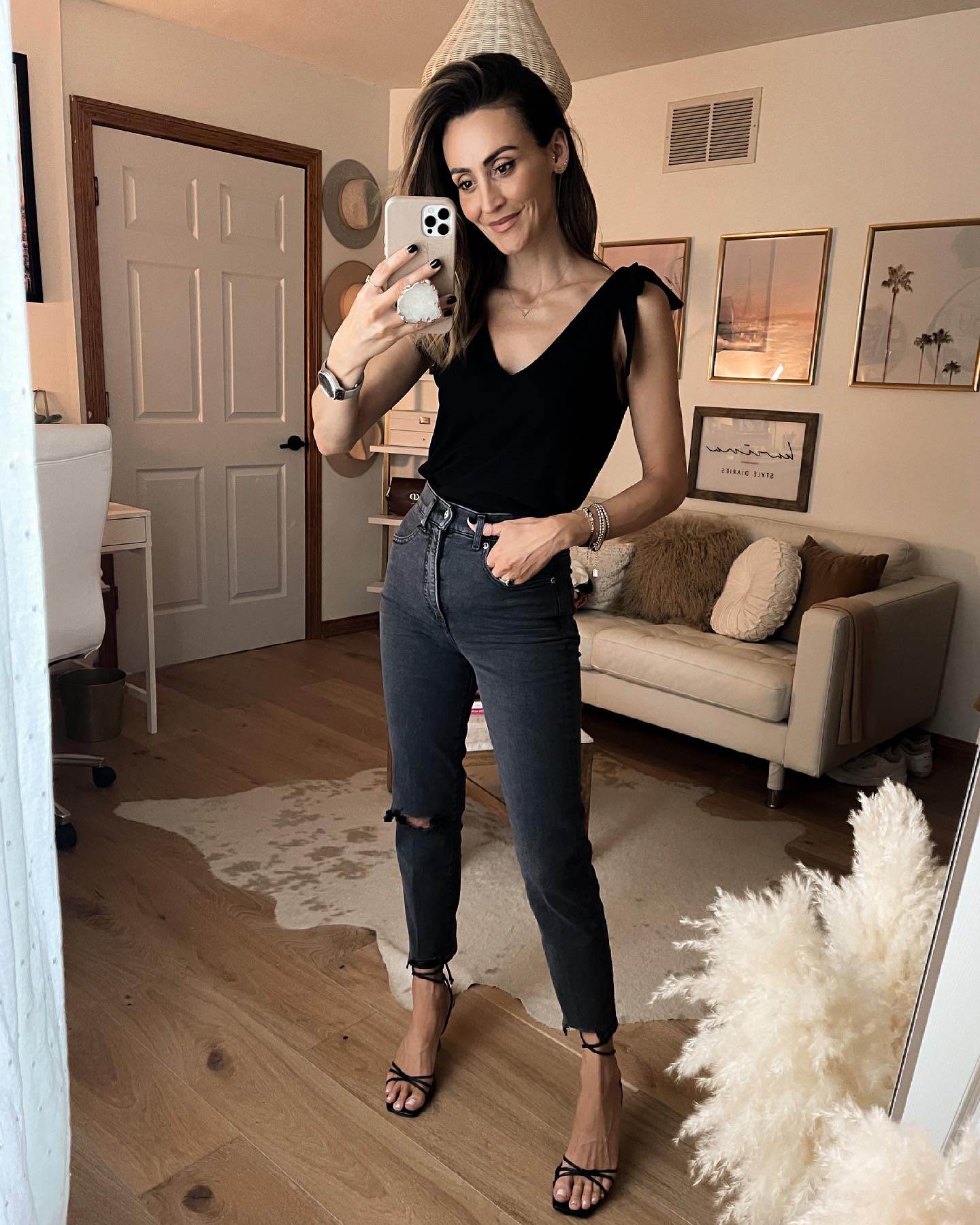 Black top with grey jeans and heels