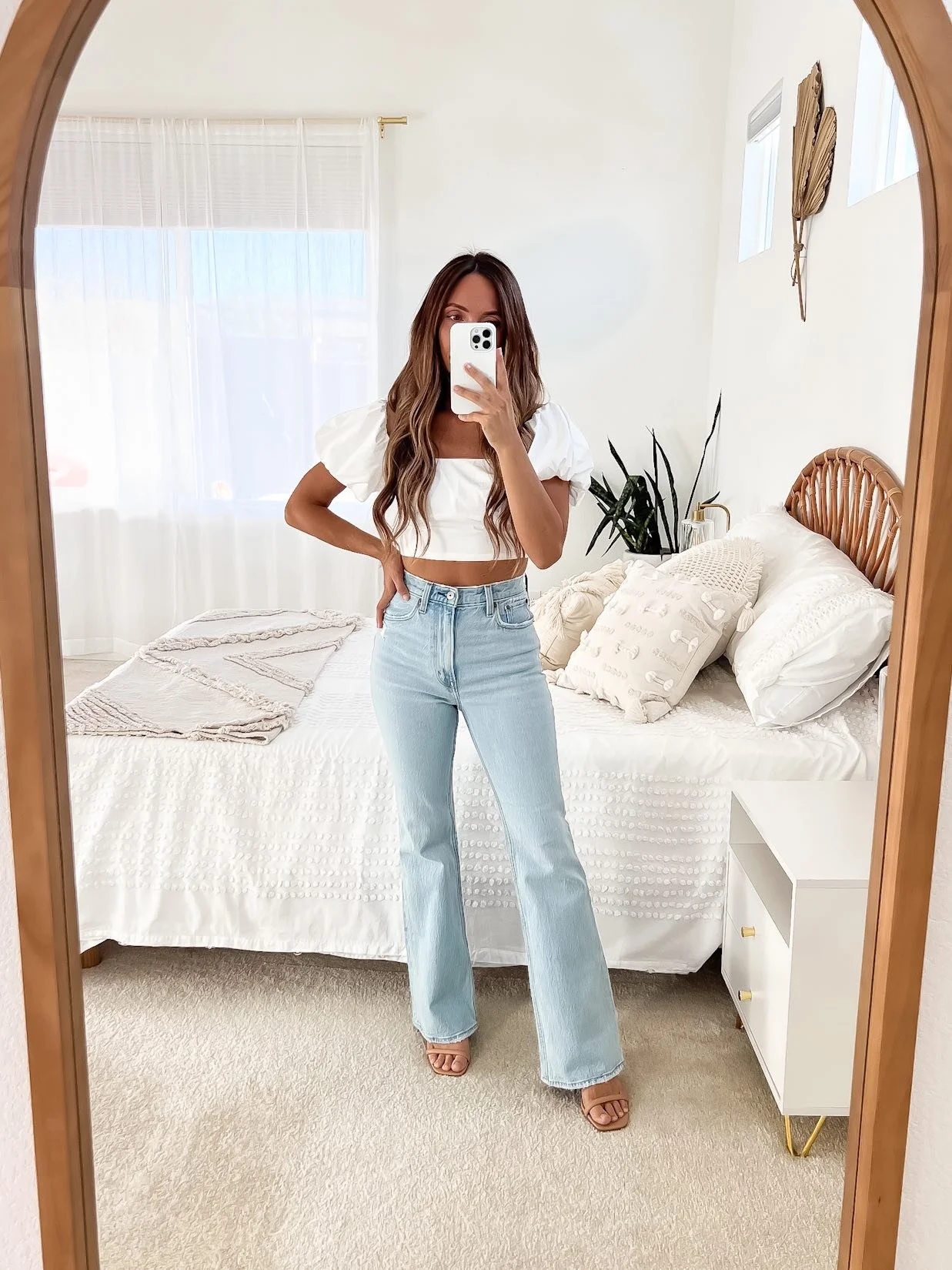 Light denim jeans with white crop top and sandals, spring casual style
