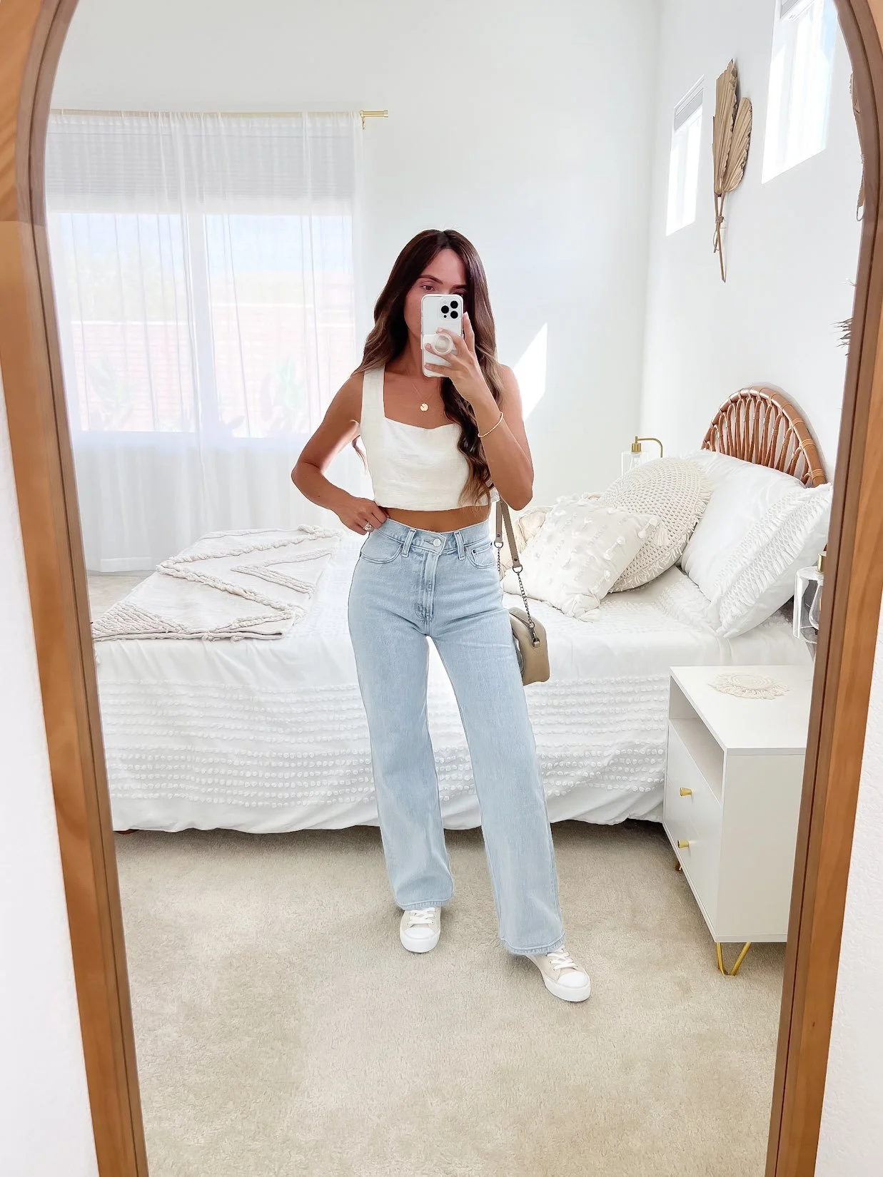 Light denim jeans with white crop top, airy spring fashion