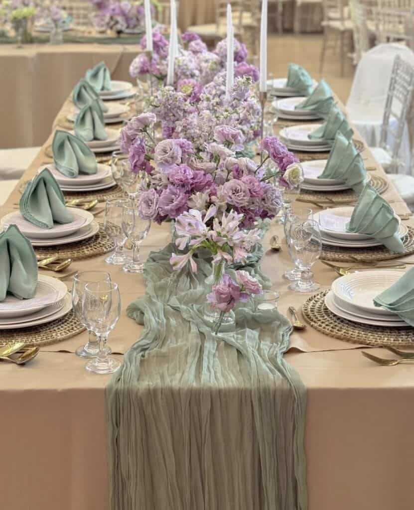 Wedding table with lavender florals and mint napkins