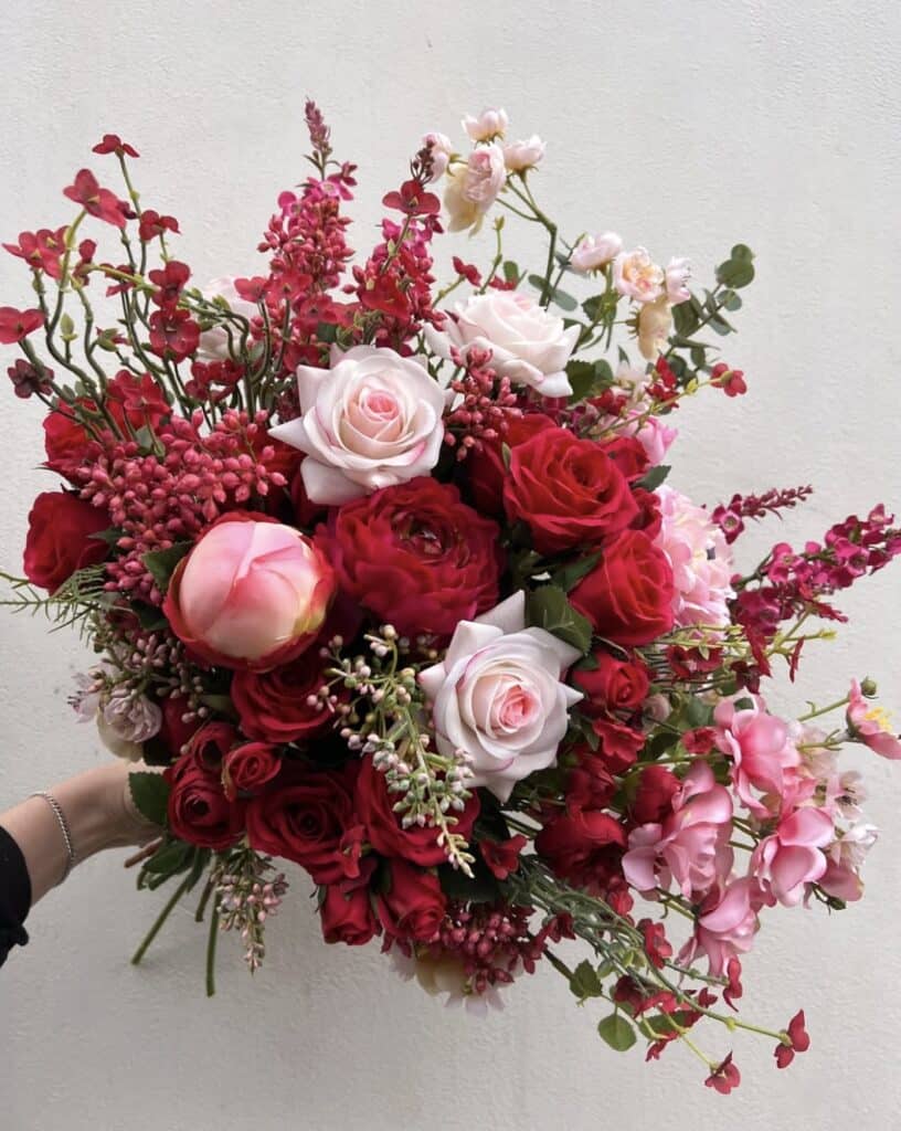 Bold red and pink floral bouquet, wedding flower arrangement