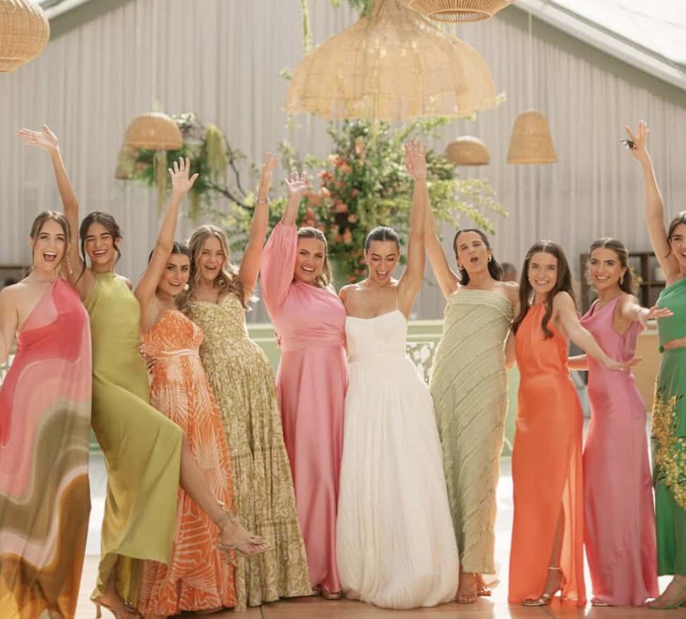 Bridesmaids in colorful dresses, joyful wedding style