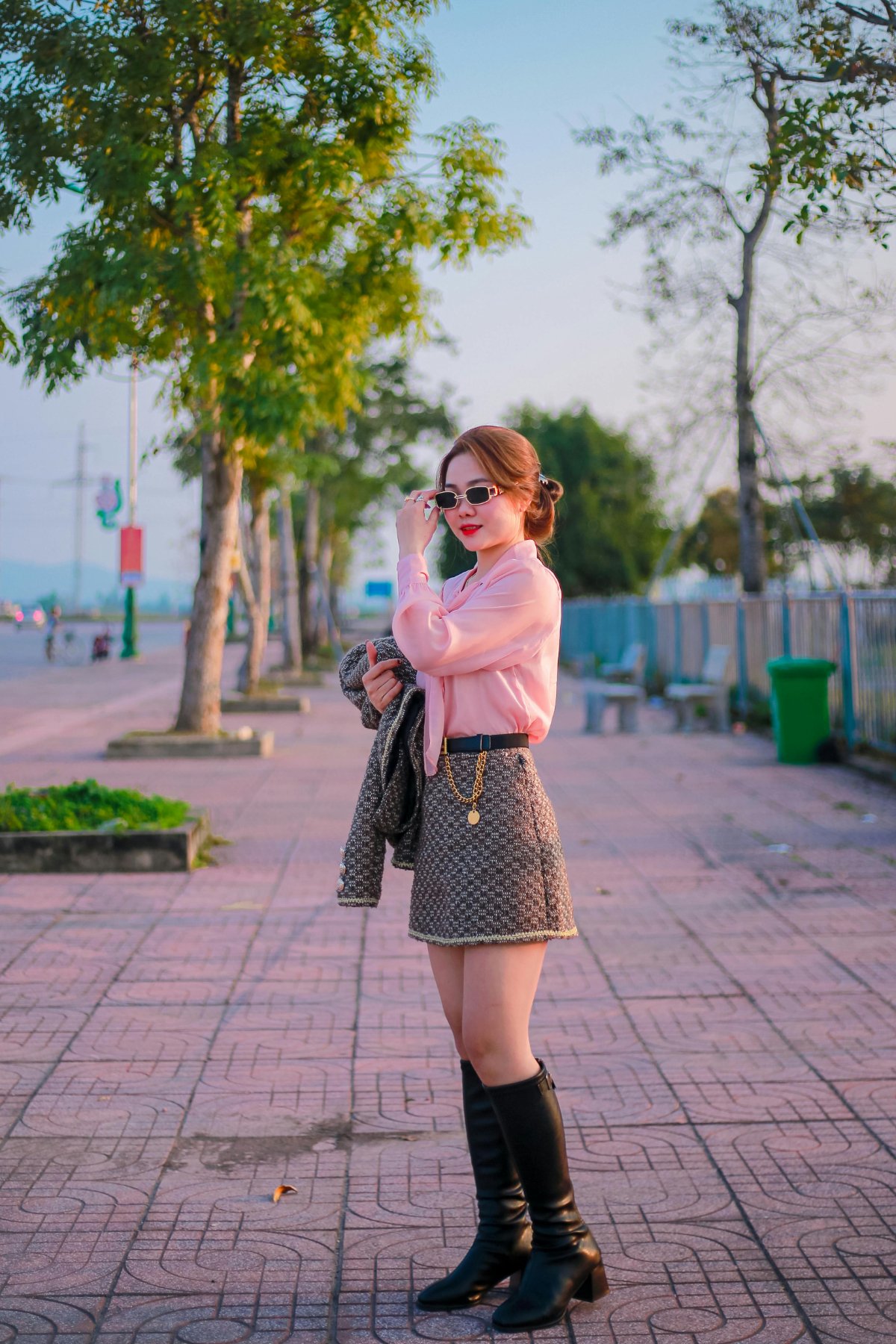 Checkered mini skirt with pink blouse and boots