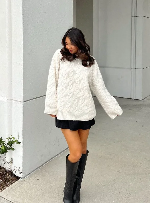 Chunky sweater with black mini skirt and boots