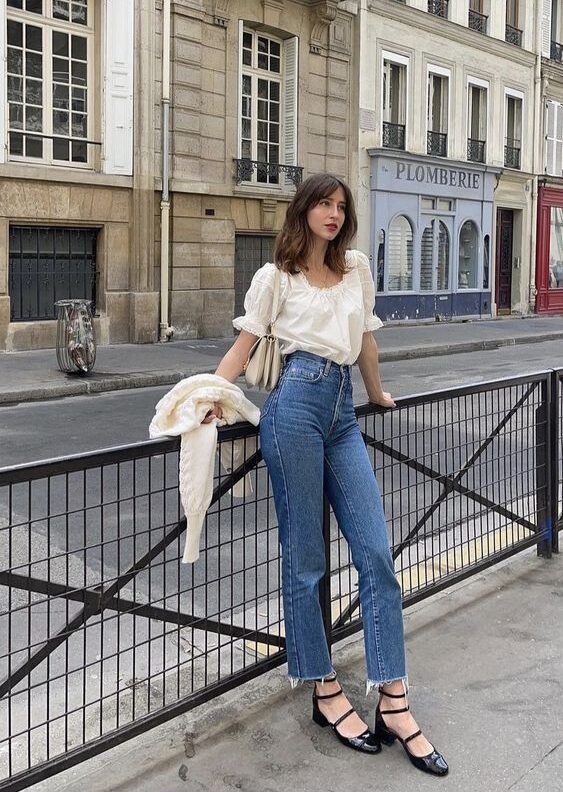 Woman in ruffled blouse and jeans, romantic spring fashion
