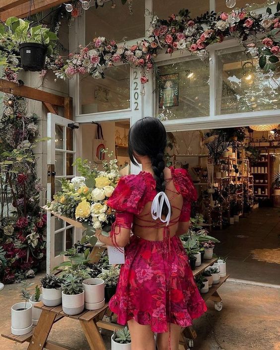 Woman in floral dress, vibrant spring fashion
