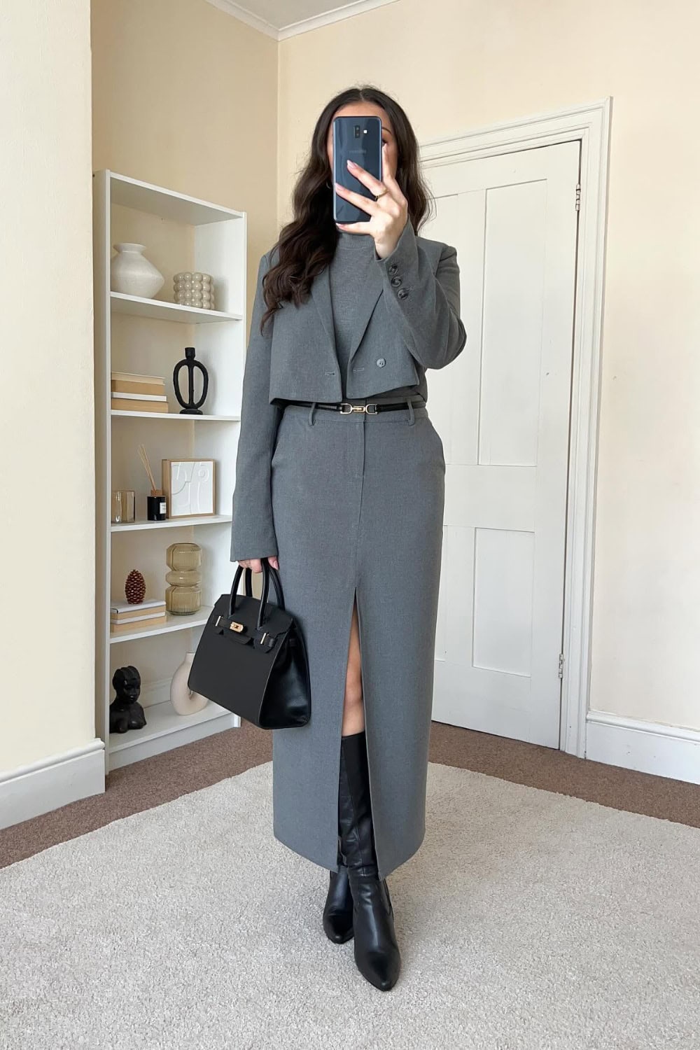 Grey suit dress with black boots, monochrome office fashion