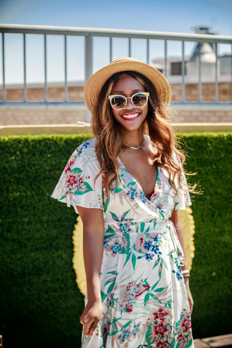 floral wrap dress with hat and sunglasses