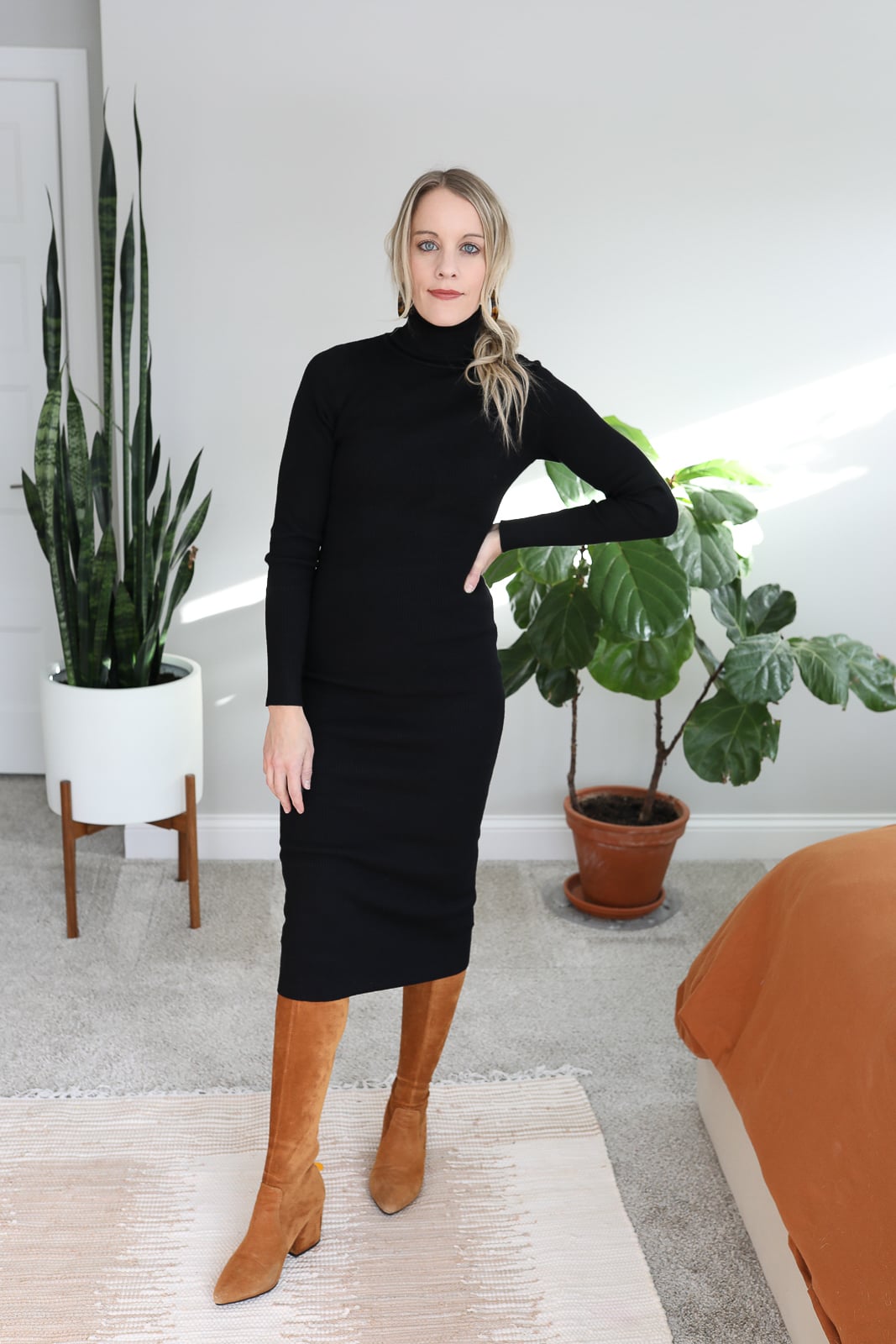 Black turtleneck maxi dress with tan boots