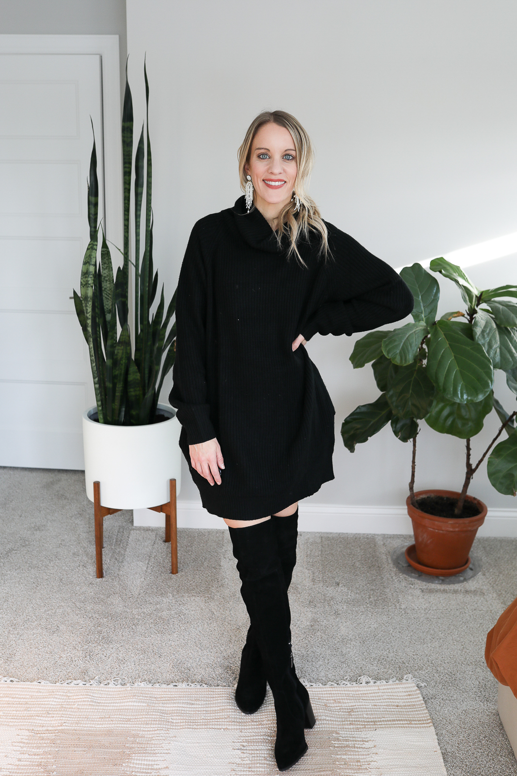Black oversized sweater dress with boots