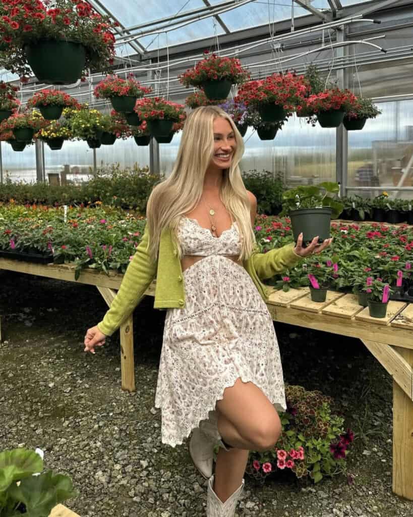 Woman in floral dress with green cardigan, bohemian spring look