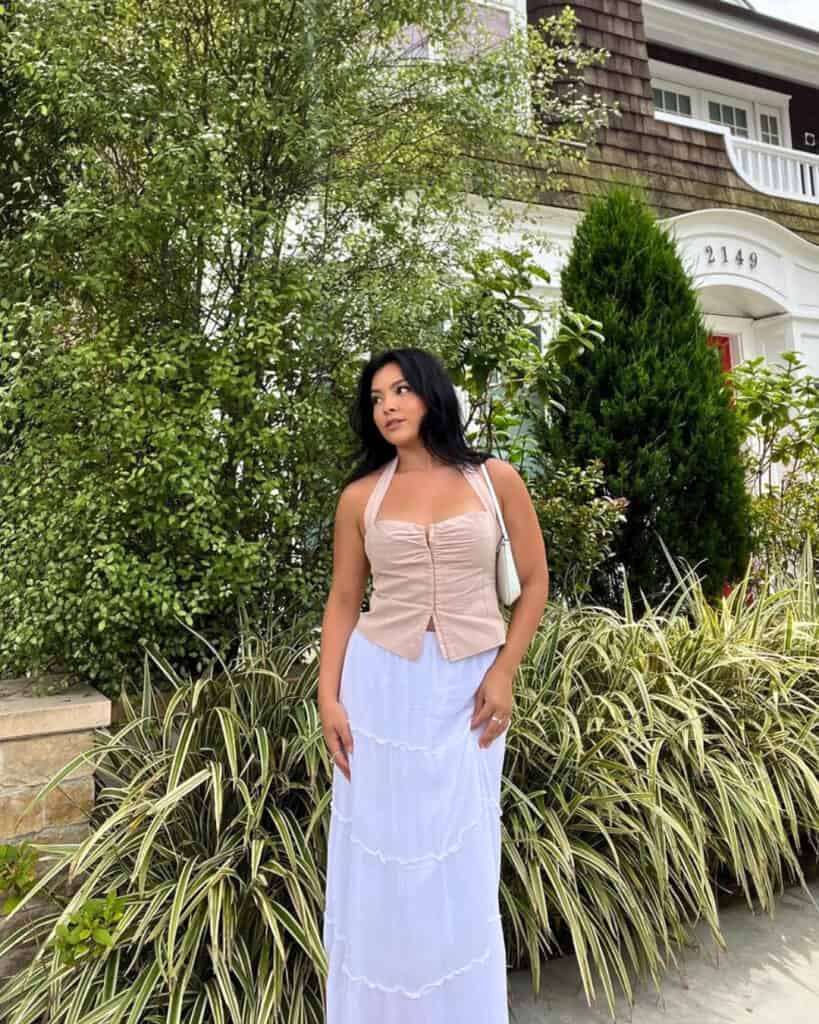 Woman in corset top and tiered skirt, elegant spring fashion