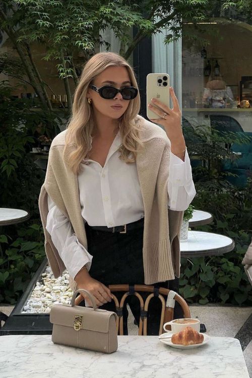 Layered knit and shirt, chic café setting