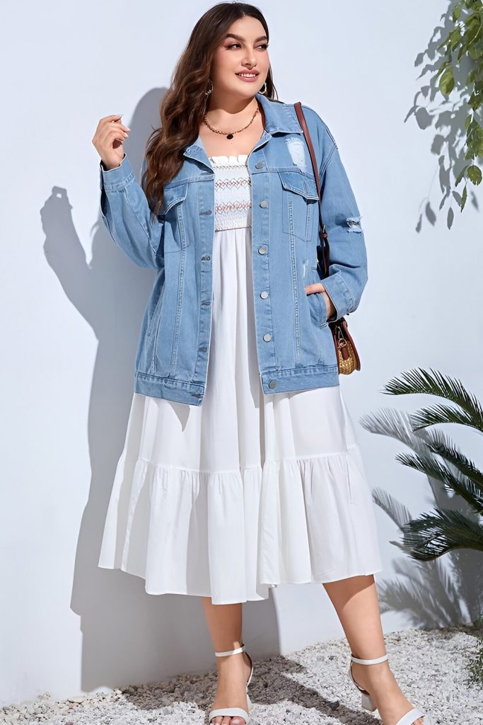 Plus size woman in polka dot blouse and denim flares, retro spring fashion.