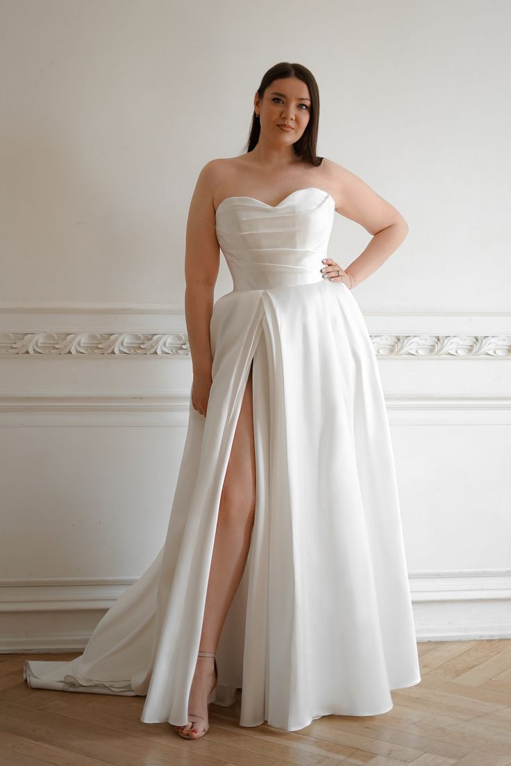 Bride in a modern strapless dress with slit