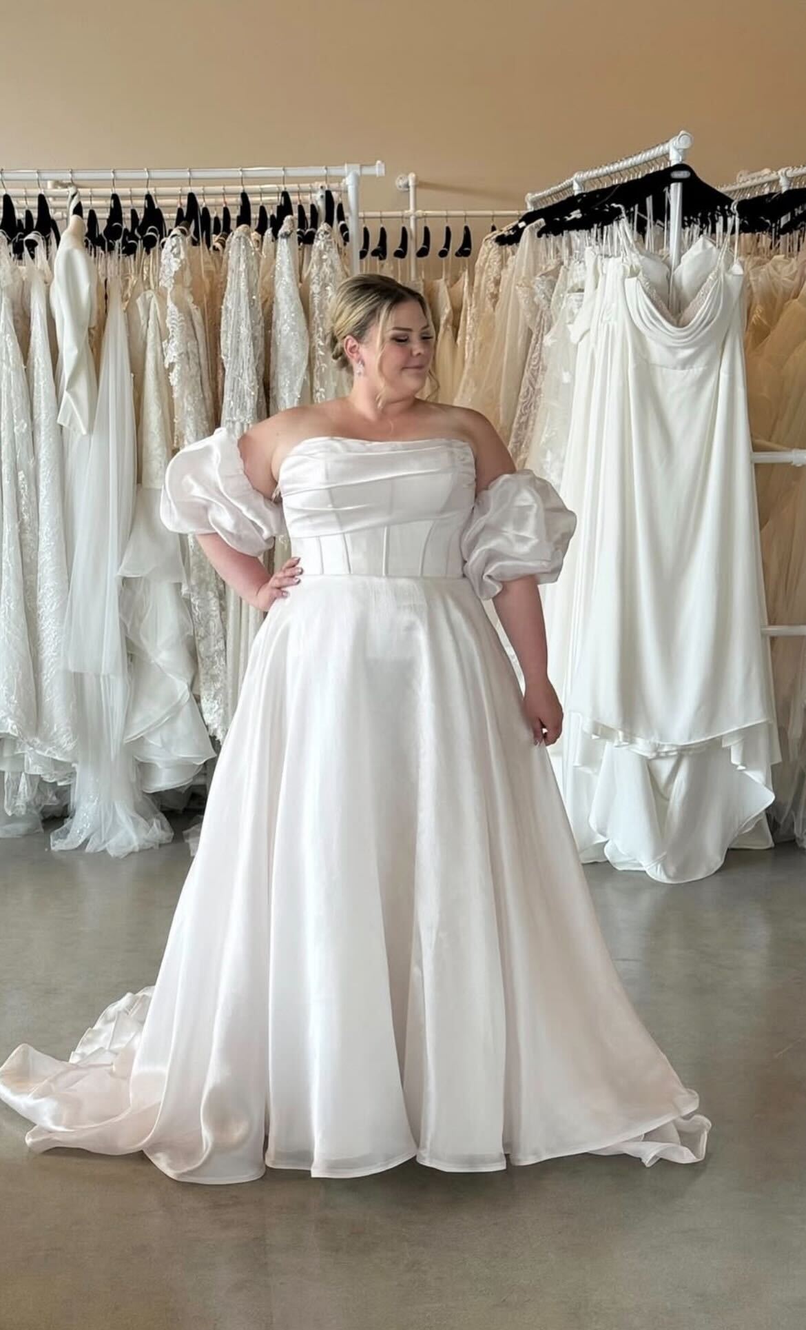 Gown with voluminous sleeves in boutique