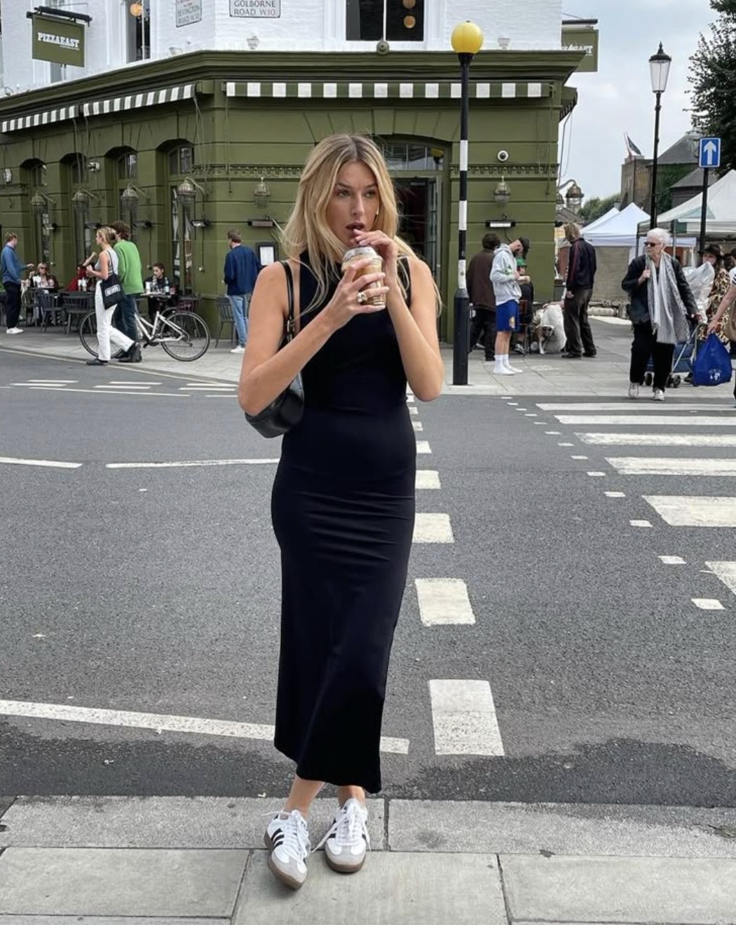 Black midi dress with sneakers, urban casual style