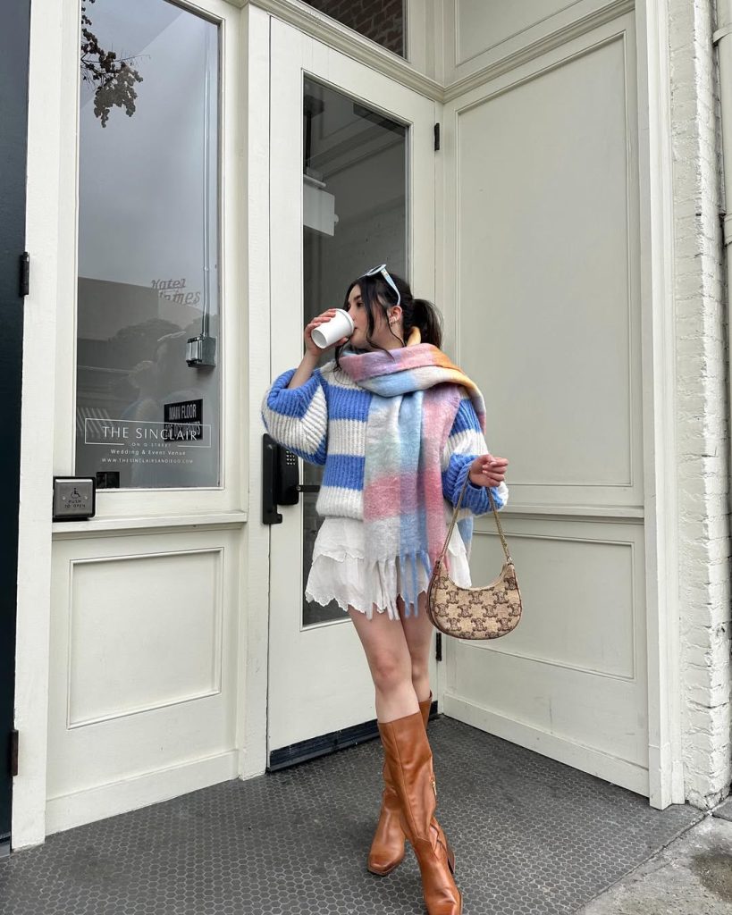Playful pastel outfit with striped sweater and scarf, perfect for spring whimsy