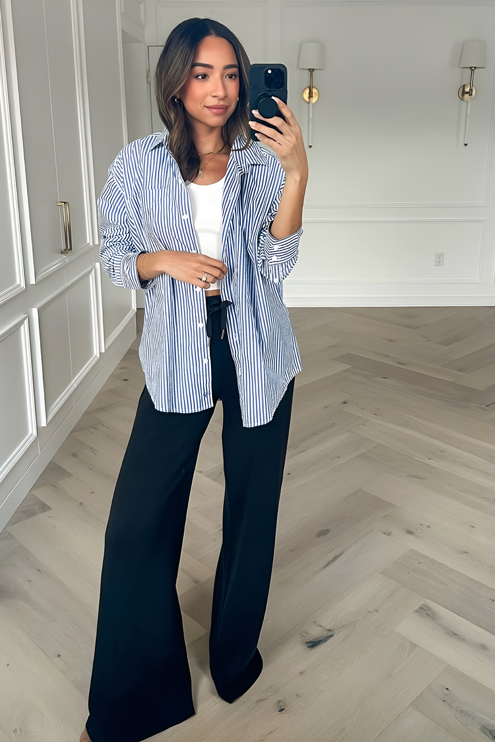 Striped shirt with black wide-leg trousers for a modern look