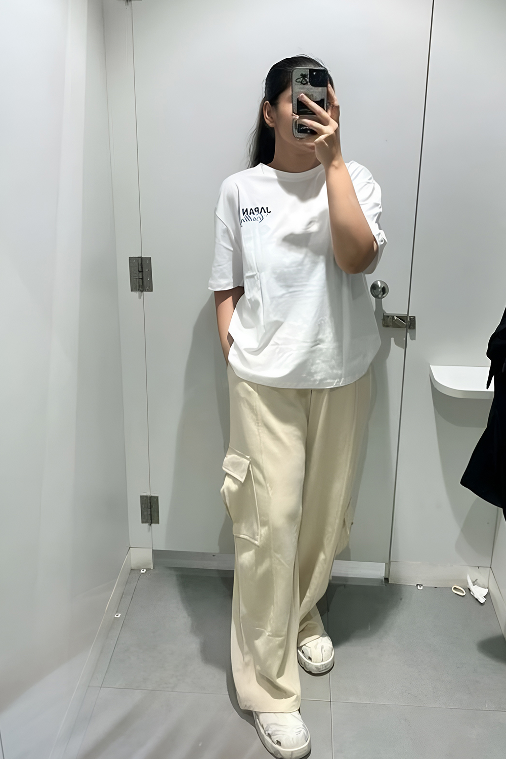 White tee with cream cargo pants for a minimalist look