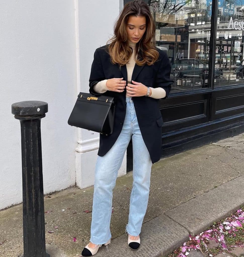 Light jeans with a black blazer and cream sweater