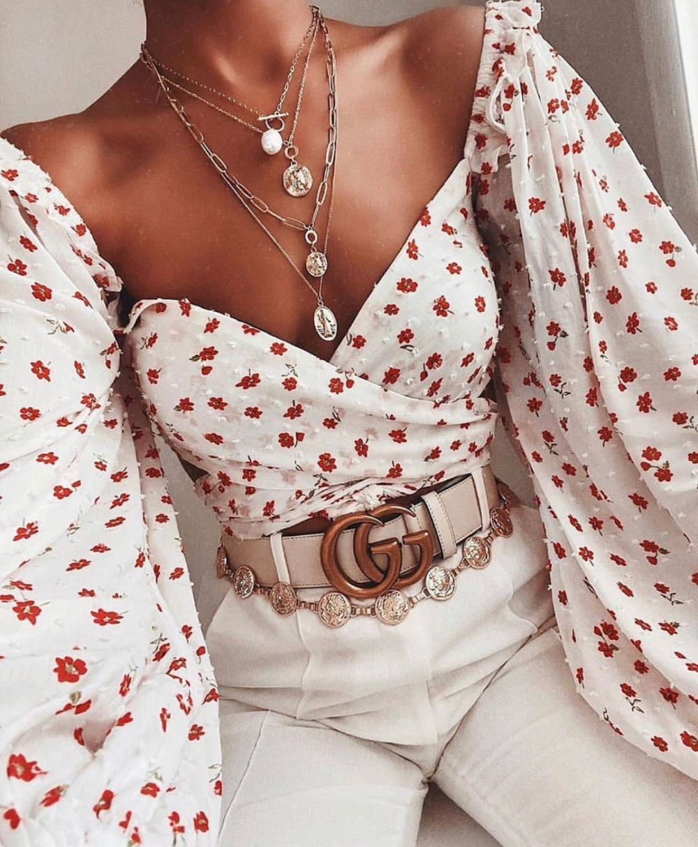 Statement blouse with floral pattern and white trousers