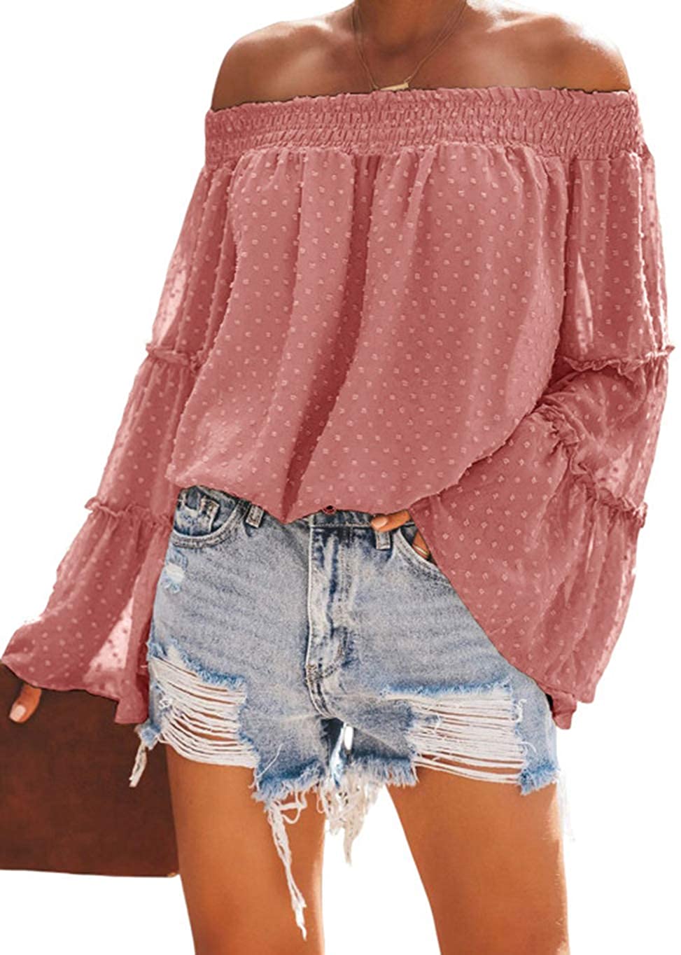 Off-the-shoulder pink top with denim shorts
