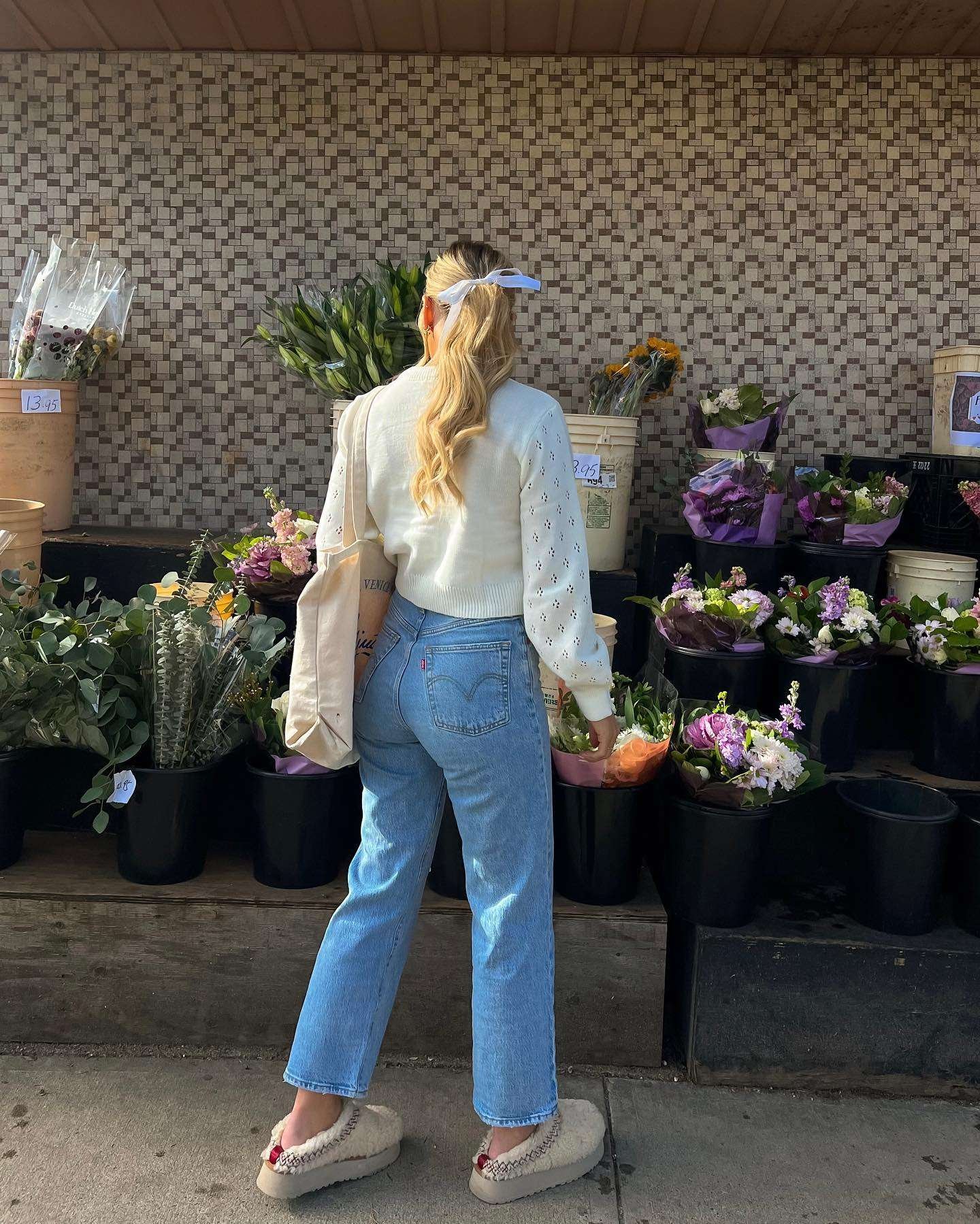 Eyelet sweater and jeans with tote