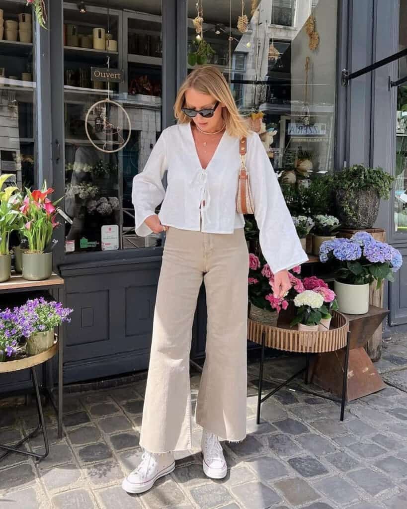 Neutral-toned outfit with wide-leg pants, spring casual style 2026