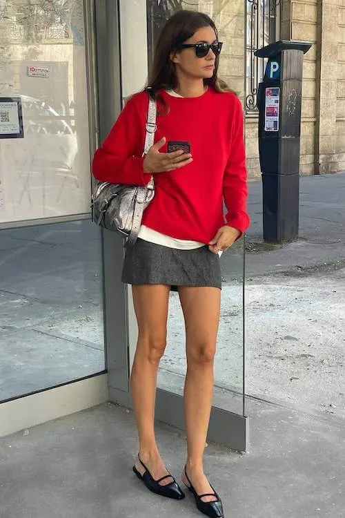Red sweater with mini skirt, urban spring style 2026