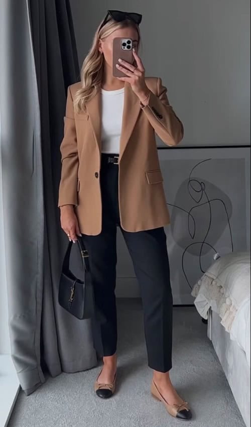 Camel blazer with black trousers for a timeless spring work outfit