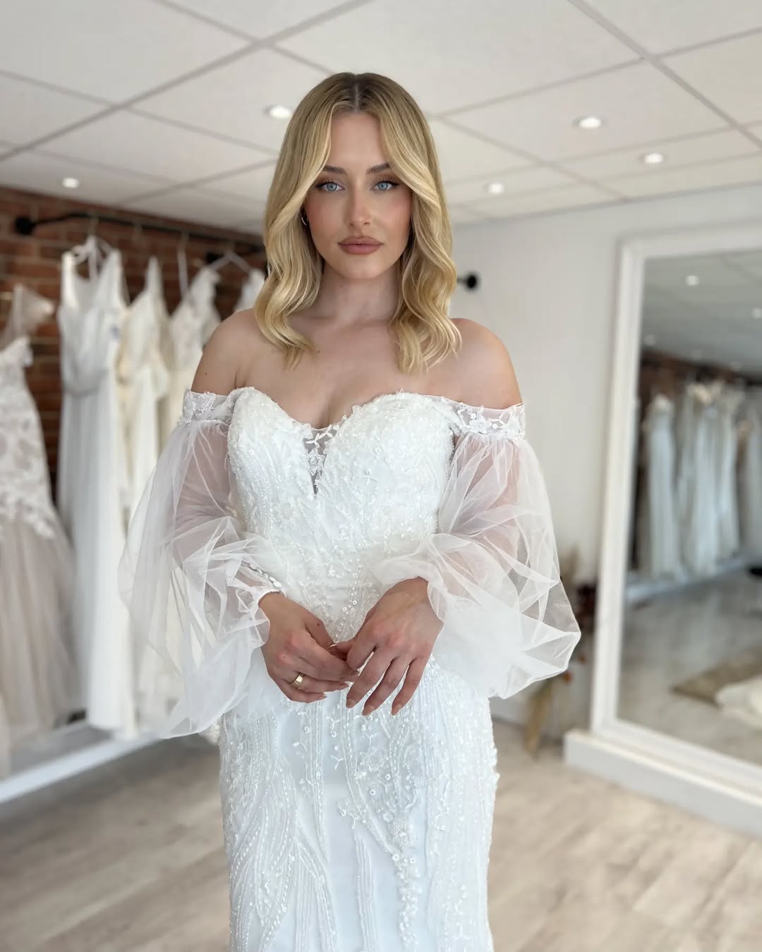 Wedding dress with dramatic tulle sleeves