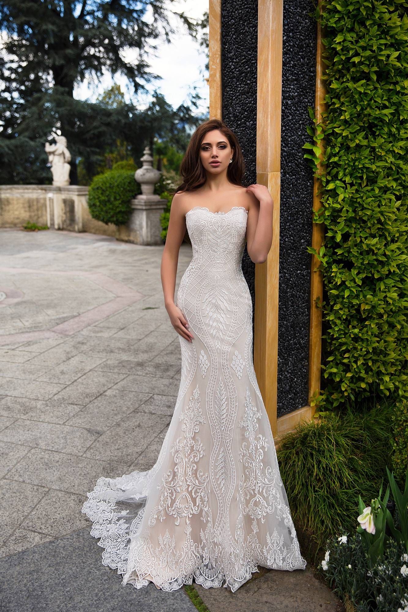 Strapless lace wedding gown with garden background