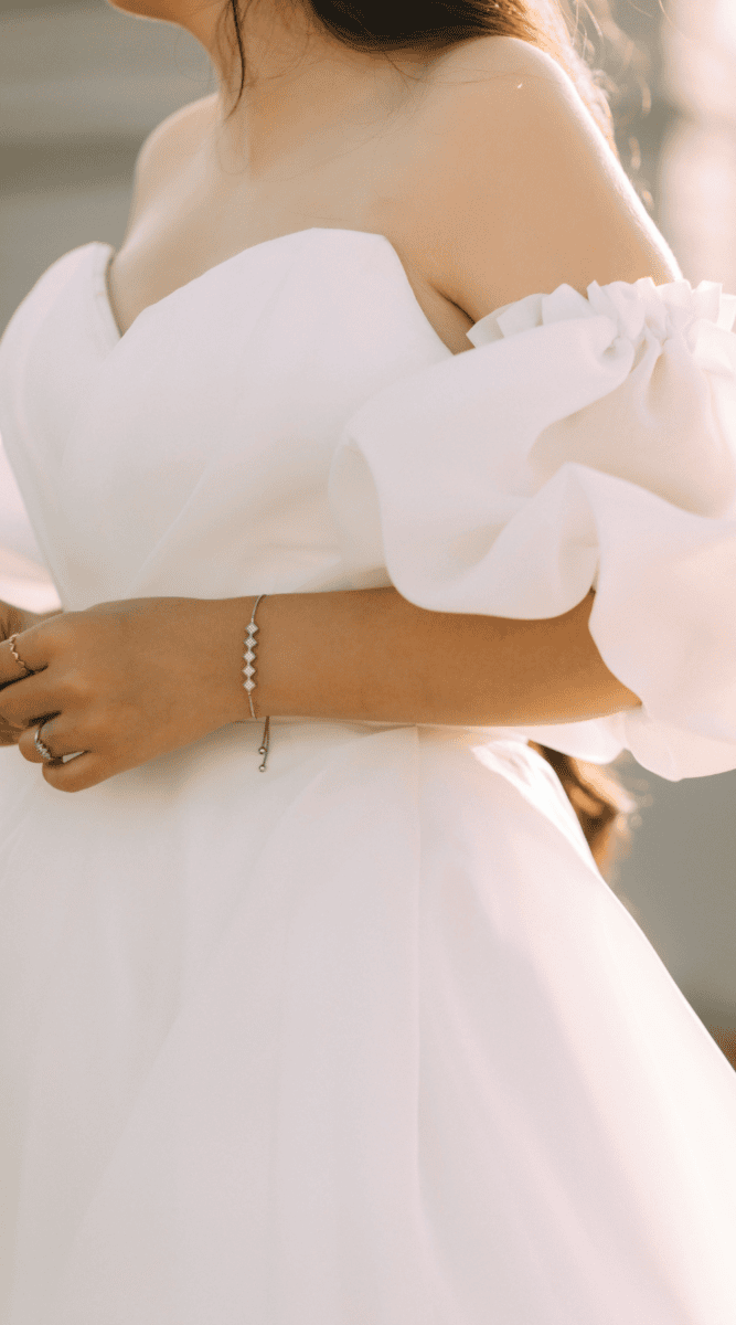 Off-shoulder wedding dress with puff sleeves