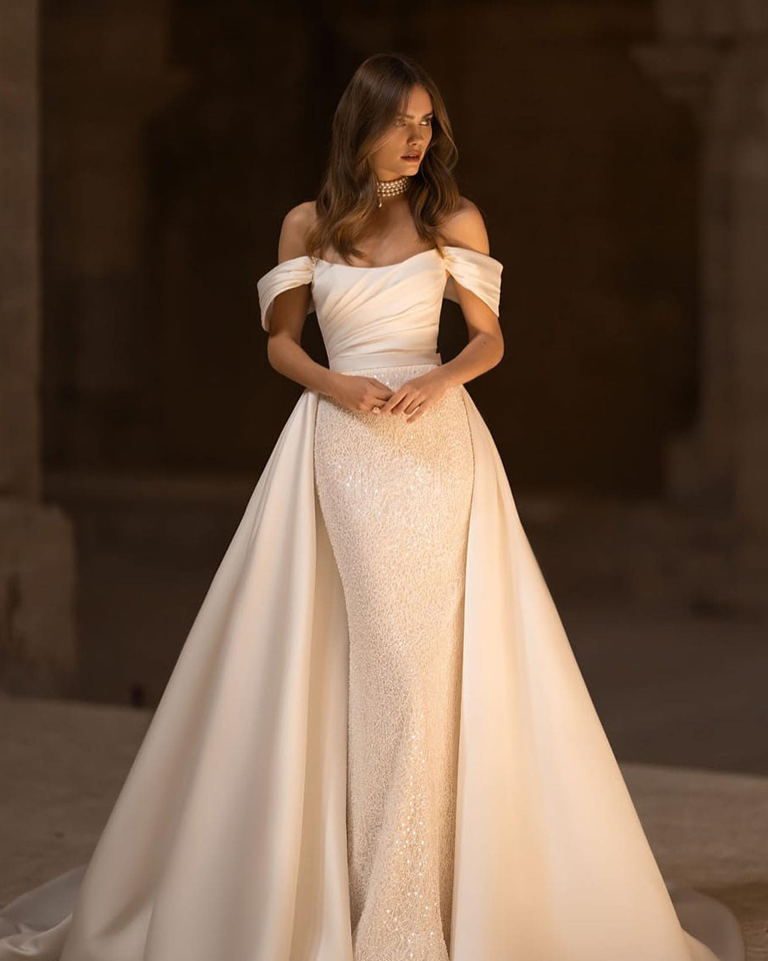 Satin off-shoulder wedding gown with train