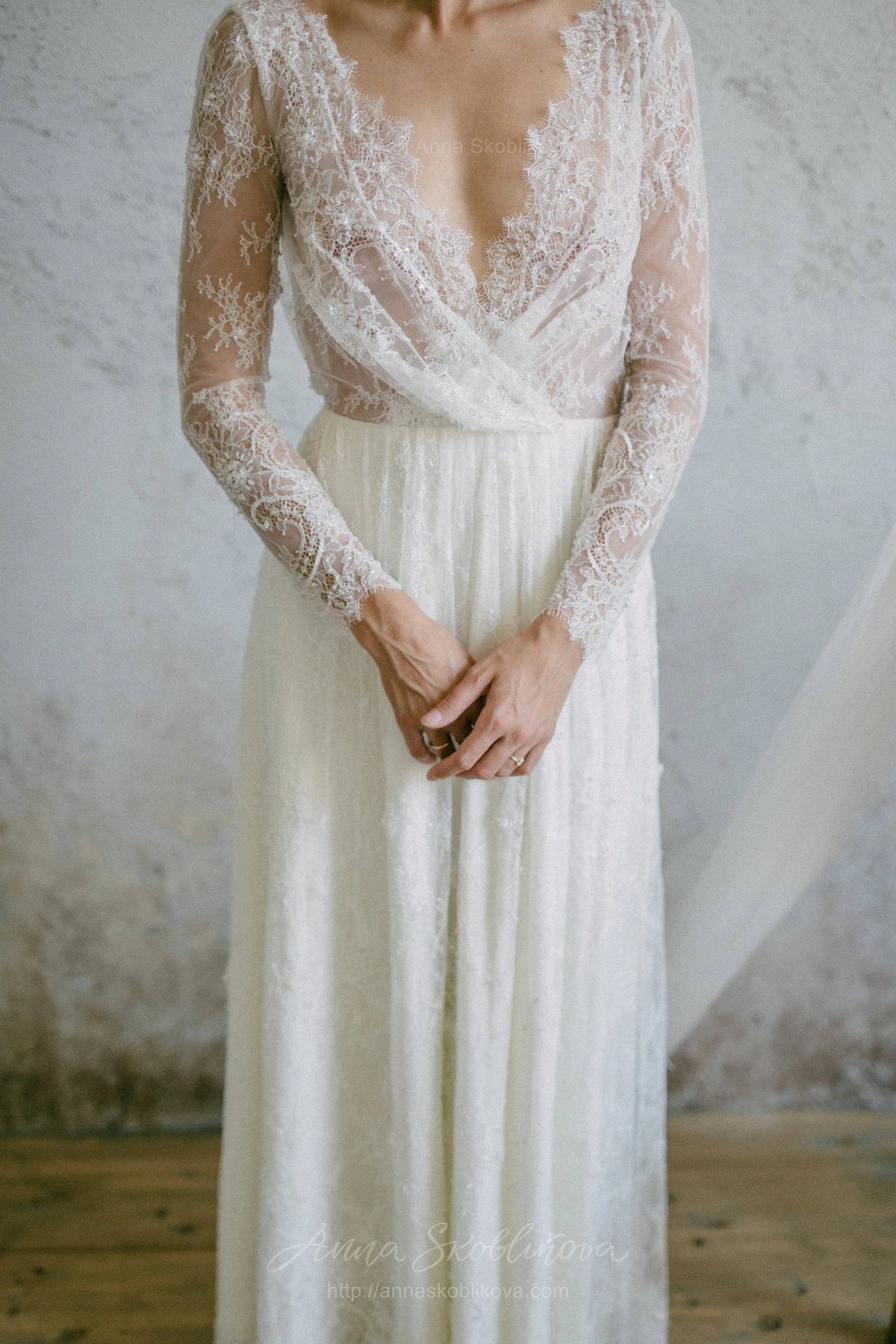 Sheer lace wedding dress with long sleeves