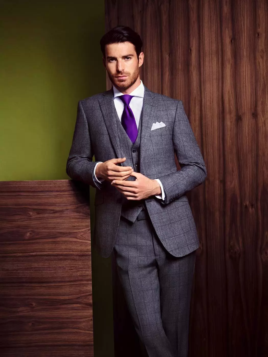Grey three-piece suit with purple tie