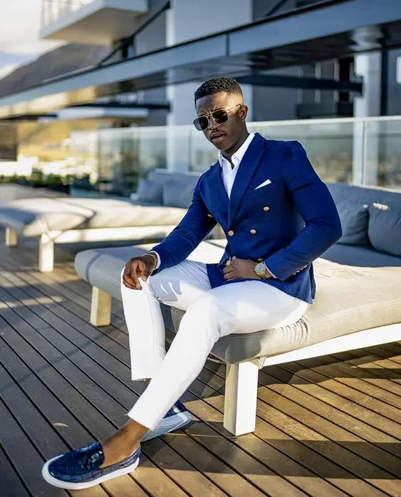 Navy blazer with white trousers