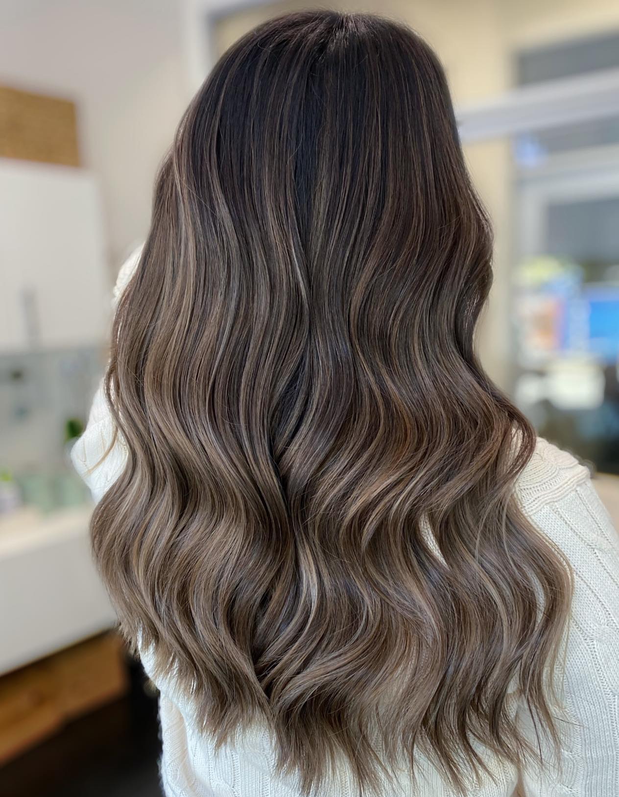 Glossy long layers in ash brown hair