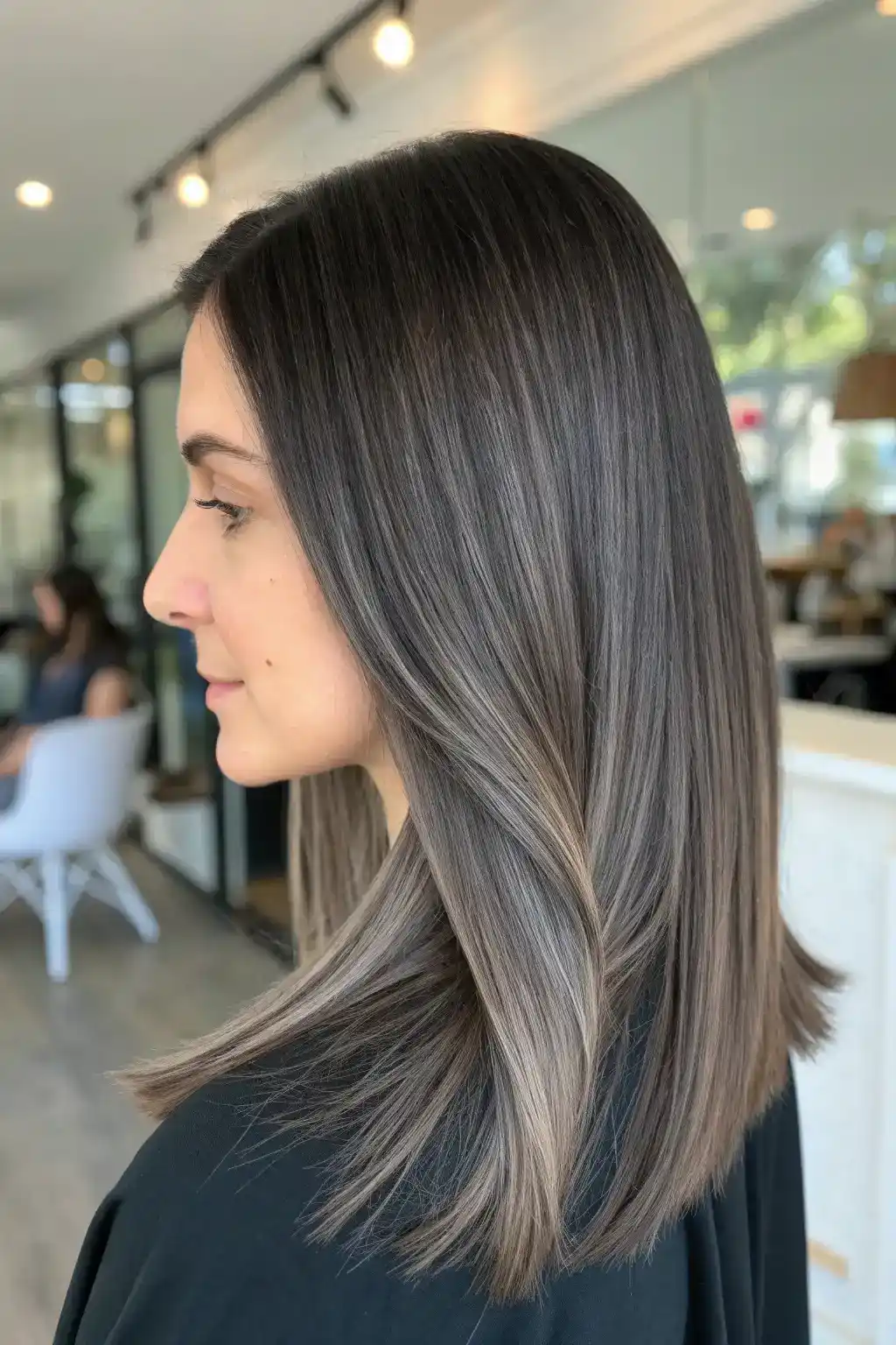 Sleek ash brown balayage on medium hair