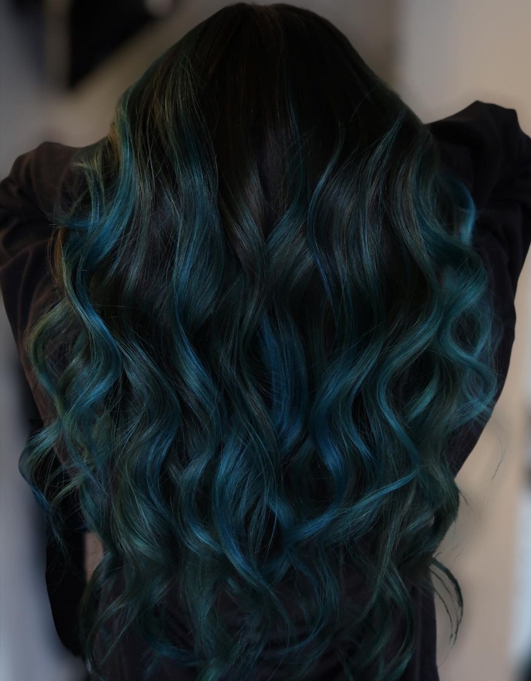Dark hair with teal balayage highlights