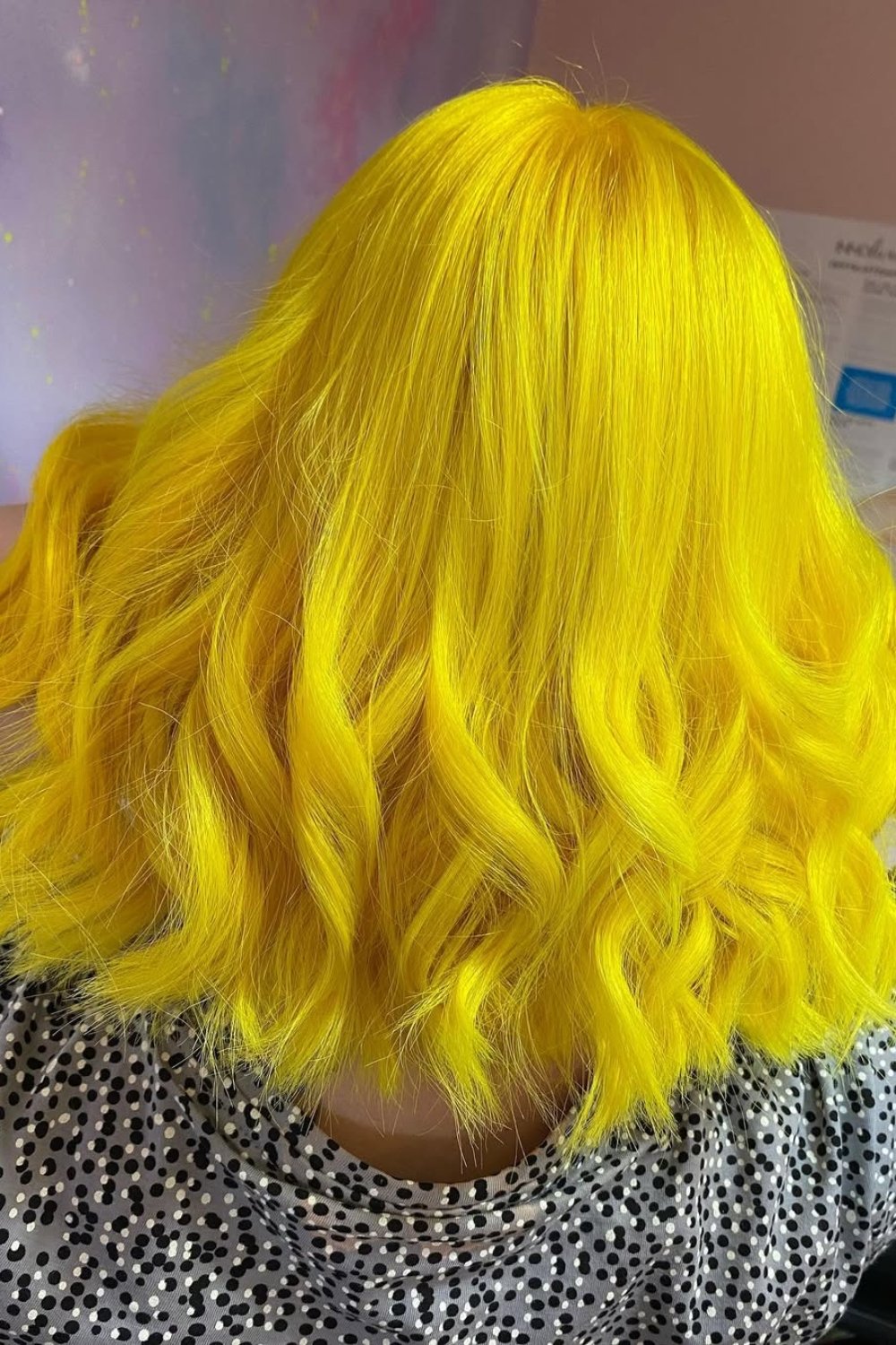 Vivid neon blonde hair with waves