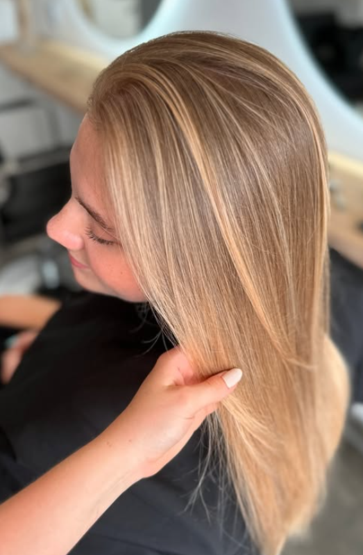 Sleek caramel blonde with straight finish