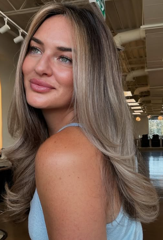 Medium-length blonde blowout with volume