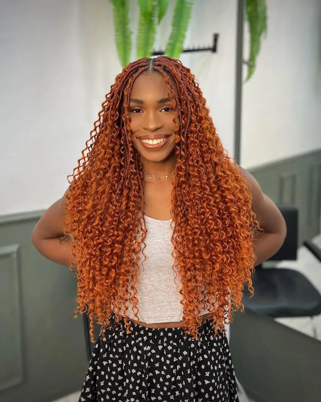 Red box braids with defined curls