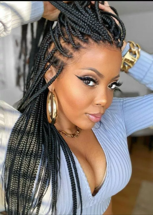 Glossy black box braids with side part